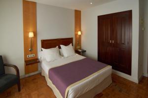 Posteľ alebo postele v izbe v ubytovaní Hotel Don Curro
