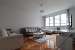 a living room with a couch and a table at Old Town Premium Apartment in Sarajevo