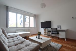 a living room with a couch and a table at Old Town Premium Apartment in Sarajevo