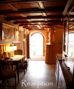 a kitchen with a table and a dining room at Bio Archehof Zachhiesen in Seekirchen am Wallersee