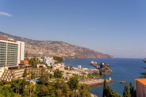 a view of the city of positano and the ocean at FLH Funchal Amazing Sea View Apartment with Pool in Funchal