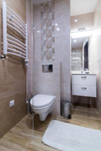 a bathroom with a toilet and a sink at Za Gościńcem in Kazimierz Dolny +70 photos