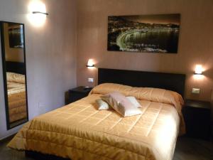Posteľ alebo postele v izbe v ubytovaní B&B Il Campanile