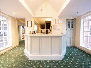 The lobby or reception area at Wincham Hall Hotel