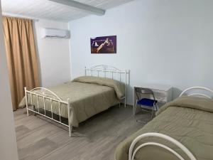 Posteľ alebo postele v izbe v ubytovaní Casa Acito