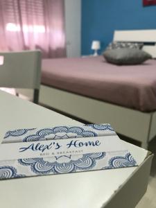 a room with two beds and a table with a mattress at Alex's Home in Portici