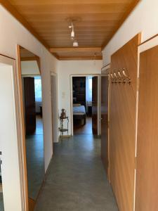 a hallway of a house with a door and a room at NED Haus in Feldkirchen bei Graz