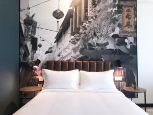 Postel nebo postele na pokoji v ubytování Travelodge Ipoh
