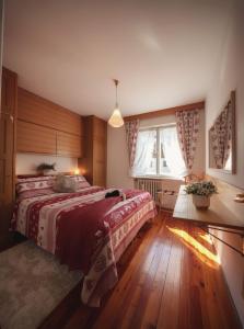 Een bed of bedden in een kamer bij Cortina-House