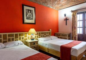 Un ou plusieurs lits dans un hébergement de l'établissement Hosteria del Frayle
