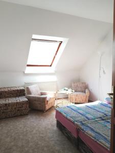Ένα ή περισσότερα κρεβάτια σε δωμάτιο στο Édenkert Apartman