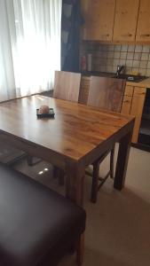 a wooden table in a kitchen with at Chalet Waldperle in Arosa