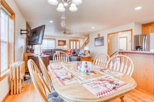 a dining room and living room with a table and chairs at Spacious Seaside Home with an Ocean View in Seaside