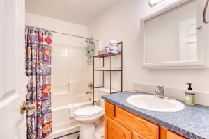 a bathroom with a sink and a toilet and a shower at Spacious Seaside Home with an Ocean View in Seaside +33 photos