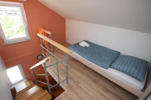 a small bedroom with a bunk bed and a ladder at Apartments Rooms PAROMLIN CENTAR in Zagreb