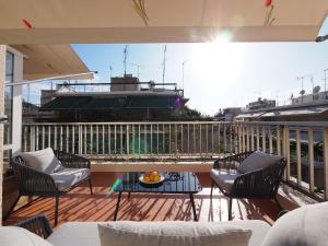 A balcony or terrace at Sophia's Penthouse Apartment With Jacuzzi and Acropolis View From Big Terrace