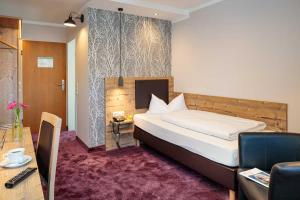 Postel nebo postele na pokoji v ubytování Hotel Pockinger Hof
