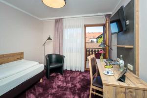 TV a/nebo společenská místnost v ubytování Hotel Pockinger Hof