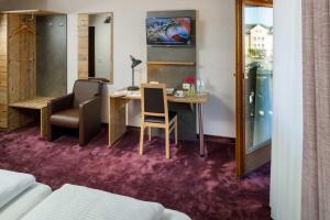 TV a/nebo společenská místnost v ubytování Hotel Pockinger Hof