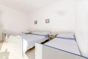 Postel nebo postele na pokoji v ubytování Apartments Tomislav