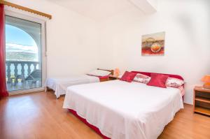Postel nebo postele na pokoji v ubytování Apartments Tomislav