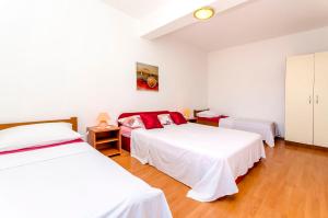 Postel nebo postele na pokoji v ubytování Apartments Tomislav