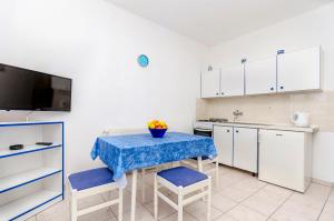 Kuchyň nebo kuchyňský kout v ubytování Apartments Tomislav