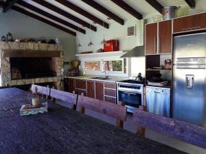 Kuchyňa alebo kuchynka v ubytovaní Complejo Arboreto