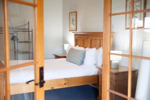 a bedroom with a bed and a bunk bed at Audrey Wilkinson Vineyard in Pokolbin