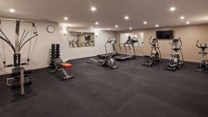 a gym with several exercise equipment in a room at Best Western Plus Montreal East in Montreal