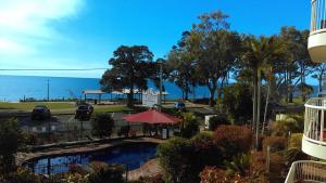 a view of the ocean from the balcony of a resort at Charlton on The Esplanade in Hervey Bay