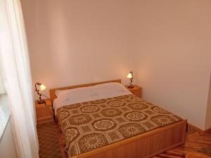 Postel nebo postele na pokoji v ubytování Apartments Jelka