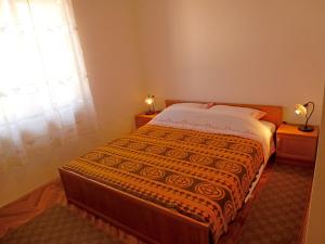 Postel nebo postele na pokoji v ubytování Apartments Jelka