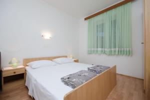 Posteľ alebo postele v izbe v ubytovaní Apartments Ruza-Rajska beach