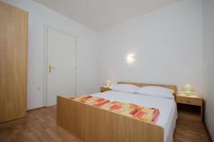 Posteľ alebo postele v izbe v ubytovaní Apartments Ruza-Rajska beach