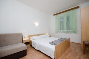Posteľ alebo postele v izbe v ubytovaní Apartments Ruza-Rajska beach