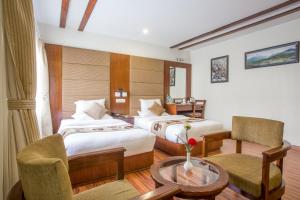 Letto o letti in una camera di Aryatara Kathmandu Hotel