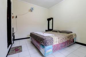 Postel nebo postele na pokoji v ubytování Cempaka Hotel