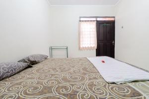 Postel nebo postele na pokoji v ubytování Cempaka Hotel
