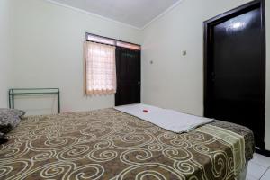 Postel nebo postele na pokoji v ubytování Cempaka Hotel