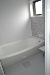 Ванна кімната в Fukui Furusato Chaya Kine to Usu