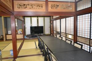 A television and/or entertainment centre at Fukui Furusato Chaya Kine to Usu