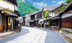an empty street in an old town with buildings at NIPPONIA HOTEL Takehara Saltworks Town in Takekara