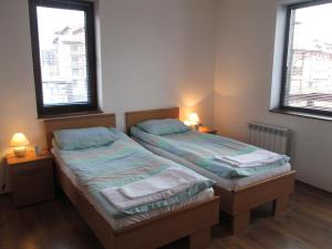 מיטה או מיטות בחדר ב-Gramadeto Complex Alexander Services Apartments