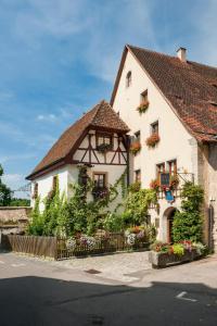 a small house with a large window at Burghotel in Rothenburg ob der Tauber