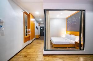 Letto o letti in una camera di Nova Highlands Hotel