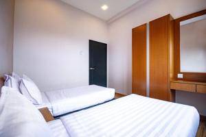 Letto o letti in una camera di Nova Highlands Hotel