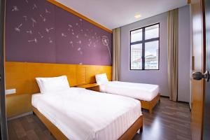 Letto o letti in una camera di Nova Highlands Hotel