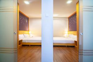 Letto o letti in una camera di Nova Highlands Hotel