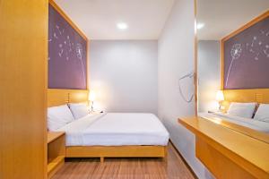 Letto o letti in una camera di Nova Highlands Hotel